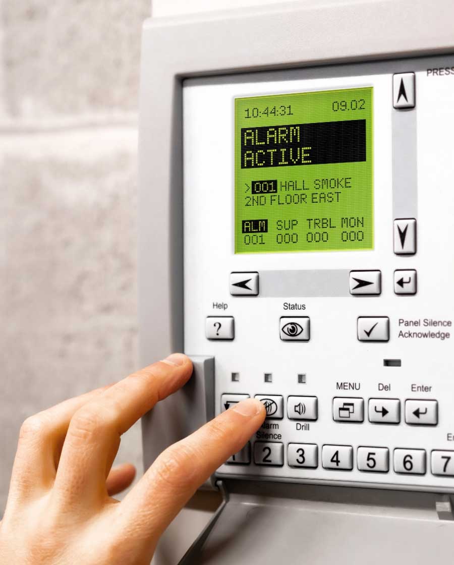 Security alarm panel with active alarm on screen